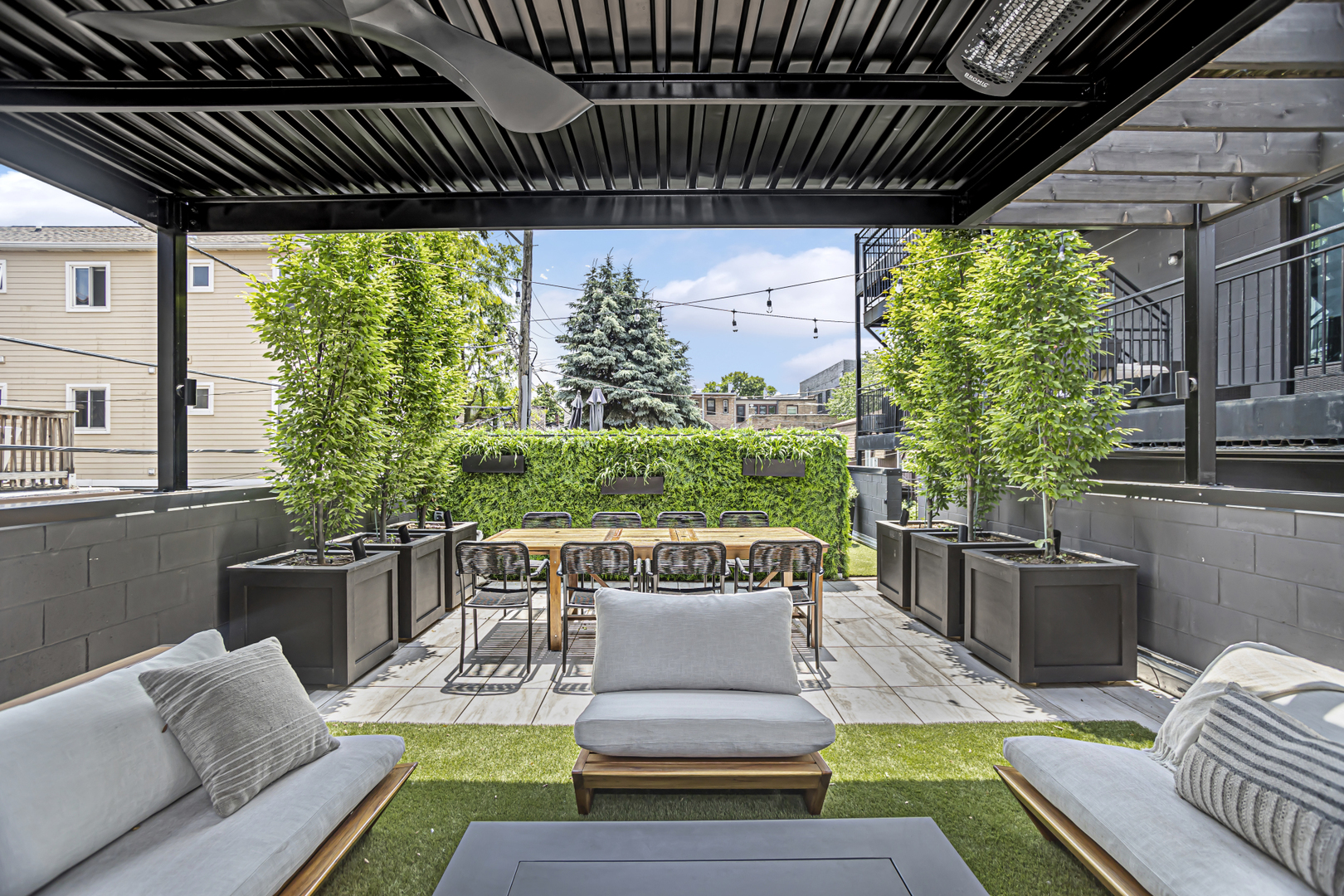 715 South May Street, Unit 1N Chicago, IL 60607 - Photo 22 of 25 a view of a patio with couches chairs and a potted plant