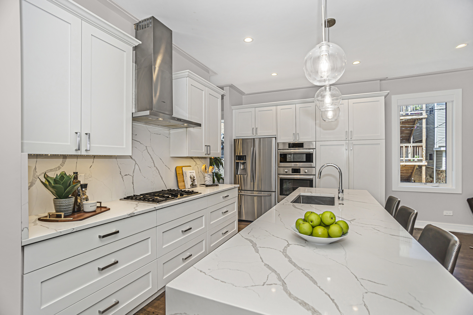 715 South May Street, Unit 1N Chicago, IL 60607 - Photo 8 of 25 a kitchen that has a lot of cabinets a stove and a wooden floor
