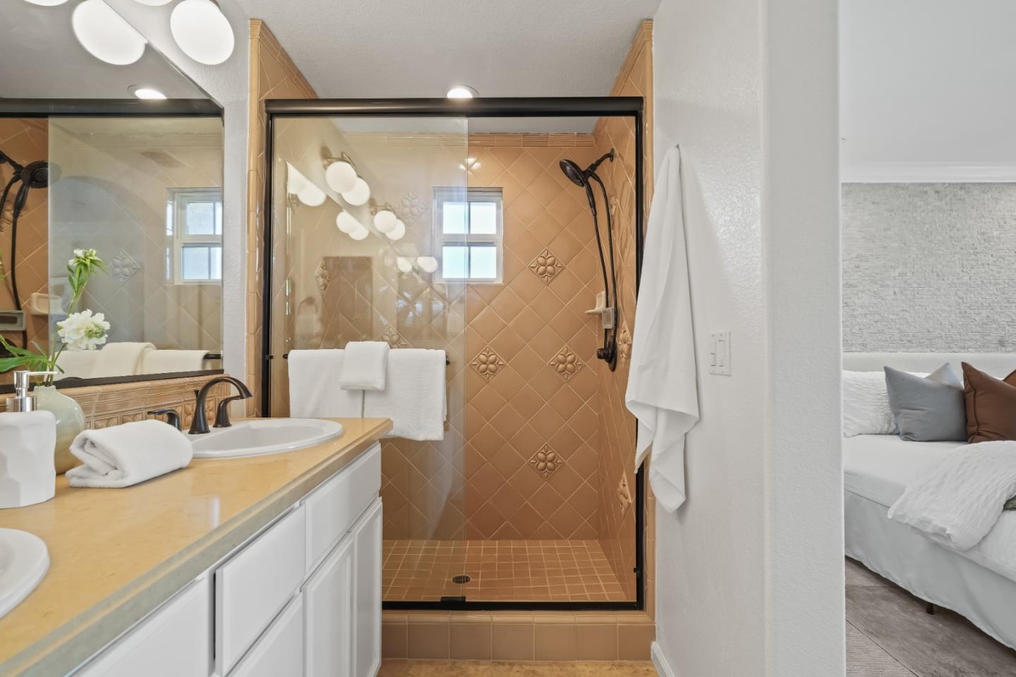 451 Chagall Street Mountain View, CA 94041 - Photo 37 of 58 a bathroom with a granite countertop sink mirror and shower