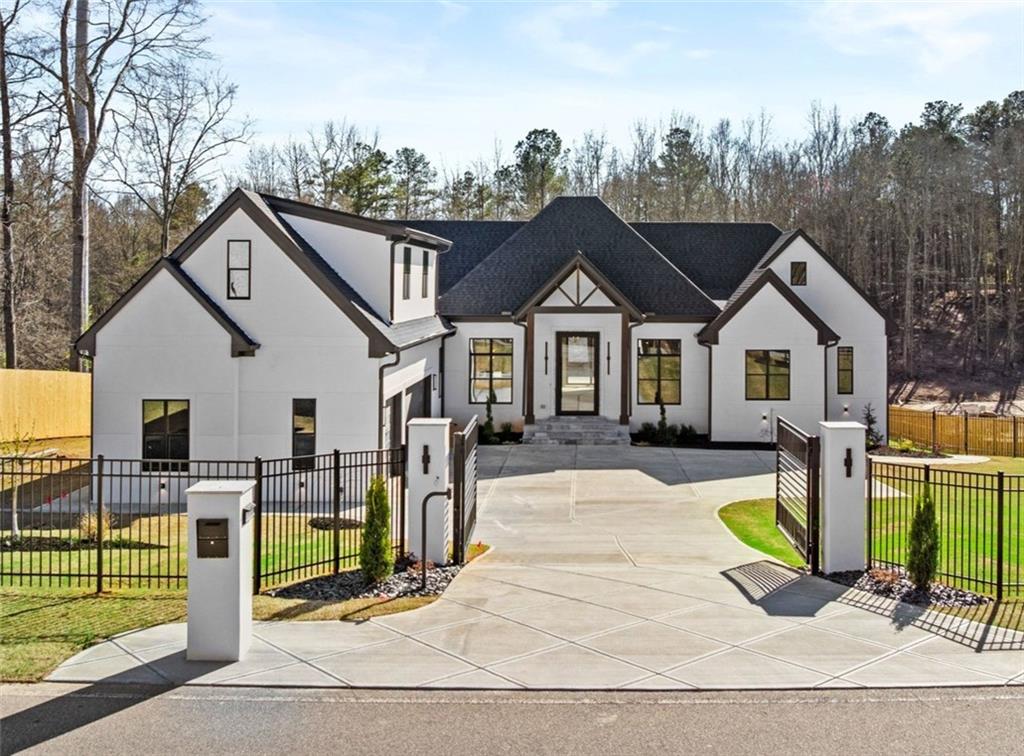 6996 Deaton Henry Road Hoschton, GA 30548 - Photo 1 of 65 a view of a house with backyard and porch
