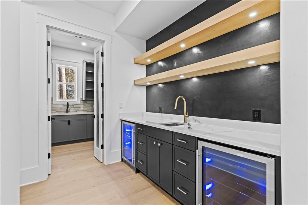 6996 Deaton Henry Road Hoschton, GA 30548 - Photo 19 of 65 a kitchen with a sink and cabinets