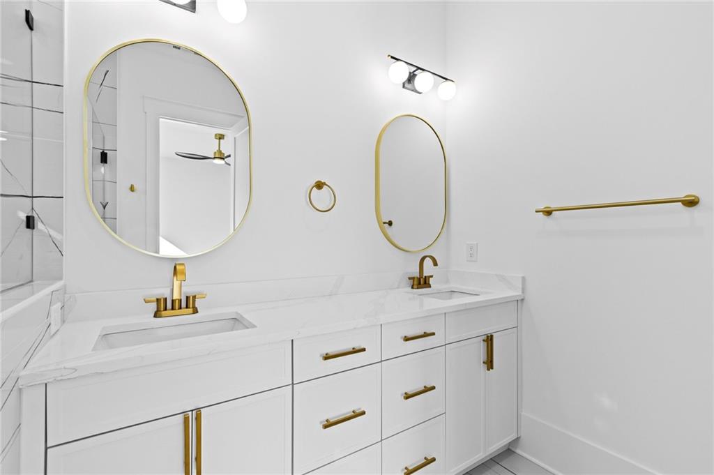 6996 Deaton Henry Road Hoschton, GA 30548 - Photo 31 of 65 a bathroom with a sink and a mirror