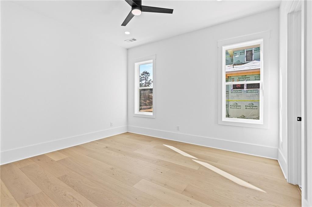 6996 Deaton Henry Road Hoschton, GA 30548 - Photo 33 of 65 an empty room with windows