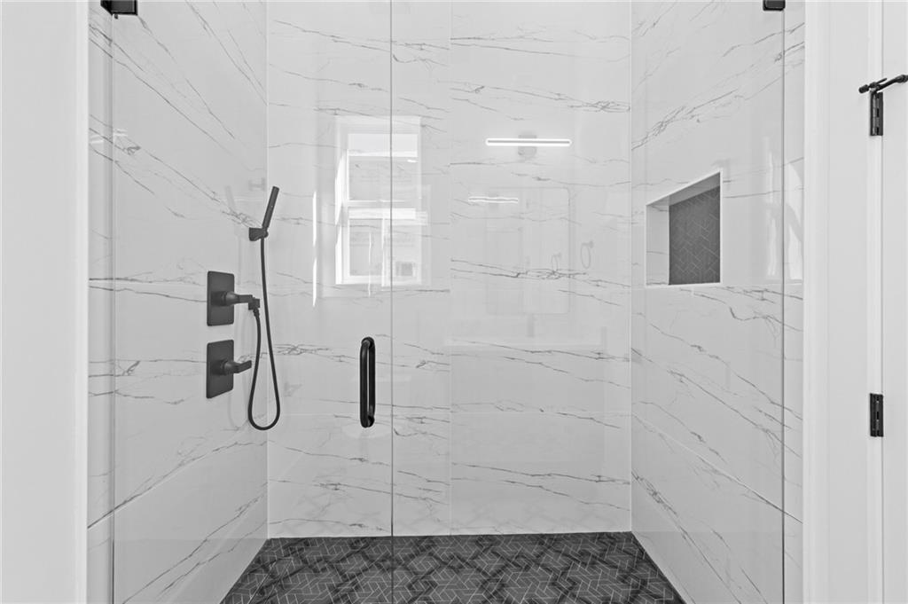 6996 Deaton Henry Road Hoschton, GA 30548 - Photo 35 of 65 a bathroom with a shower