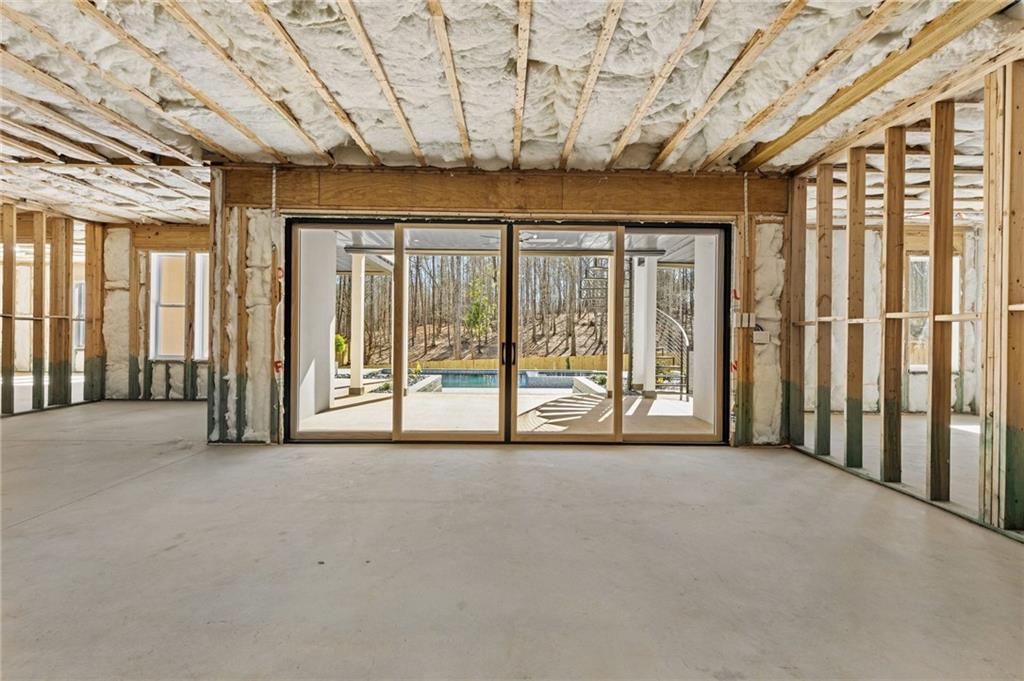 6996 Deaton Henry Road Hoschton, GA 30548 - Photo 46 of 65 a view of an empty room with a sliding door