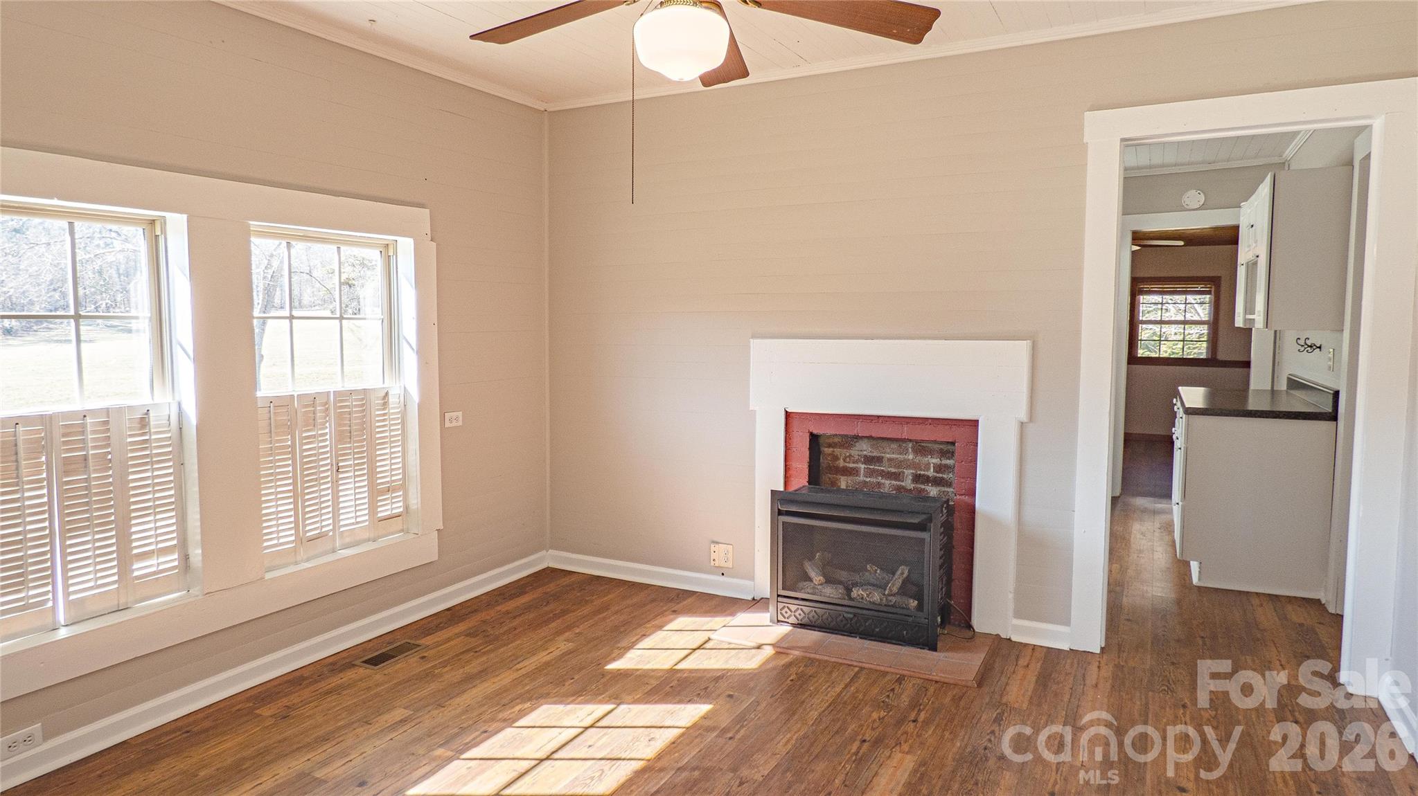 3920 St Peters Church Road Salisbury, NC 28146 - Photo 11 of 32 a view of an empty room with window and wooden floor
