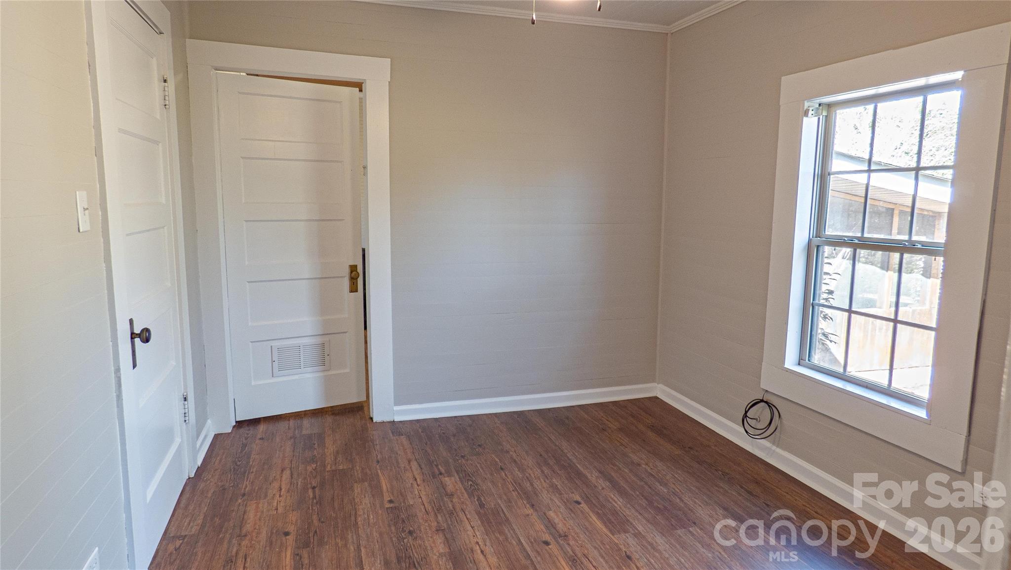 3920 St Peters Church Road Salisbury, NC 28146 - Photo 13 of 32 an empty room with wooden floor and windows