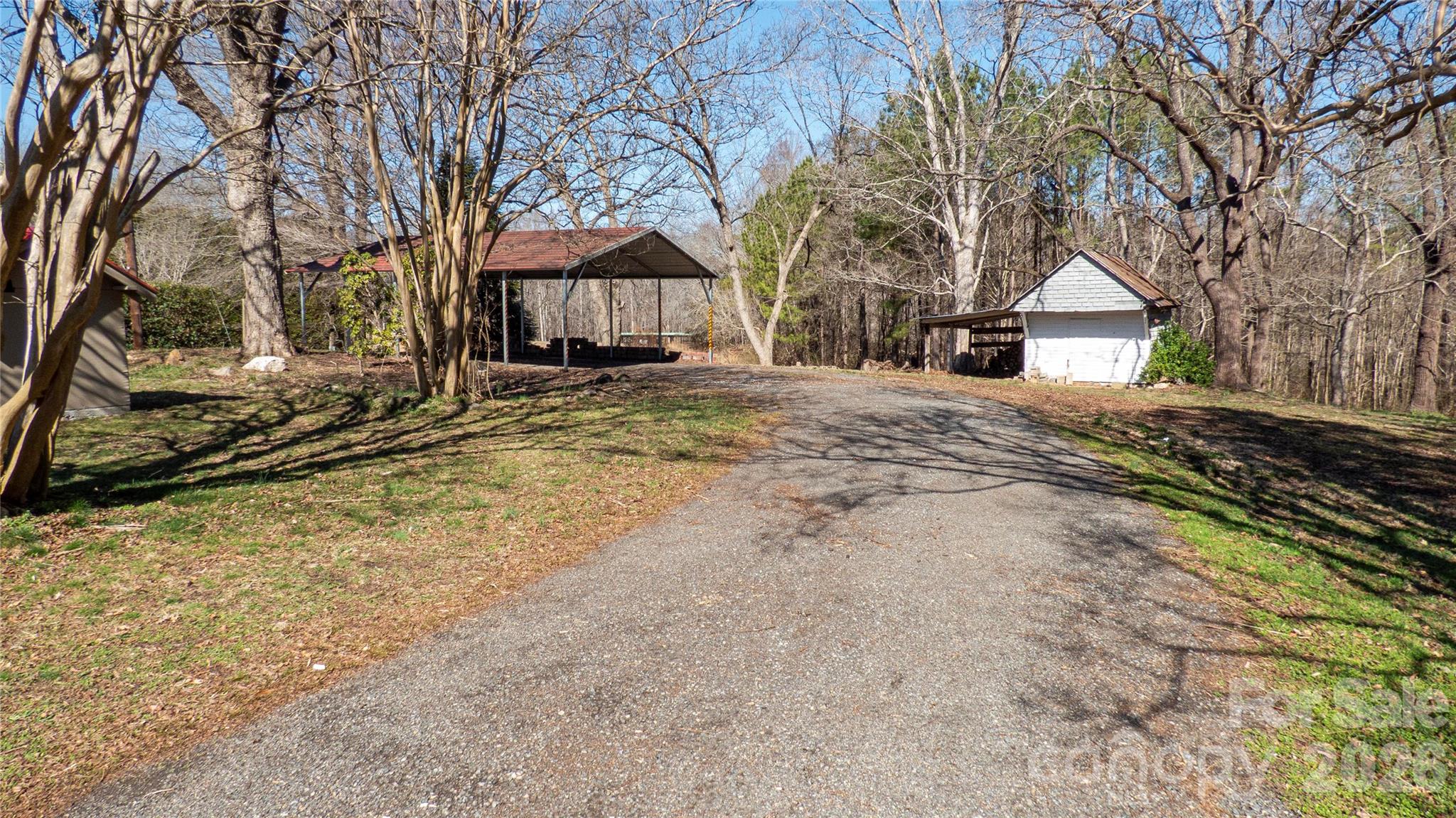 3920 St Peters Church Road Salisbury, NC 28146 - Photo 29 of 32 a view of a house with a yard covered in snow