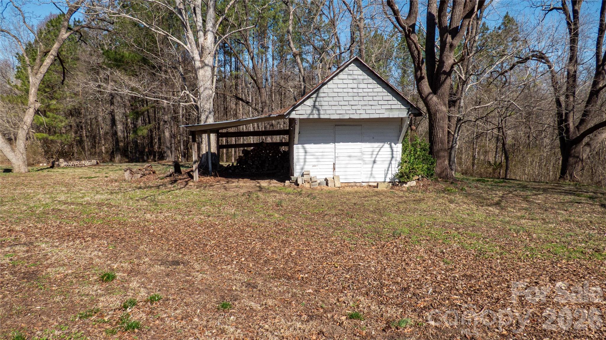 3920 St Peters Church Road Salisbury, NC 28146 - Photo 30 of 32 a view of a house with a yard and garage