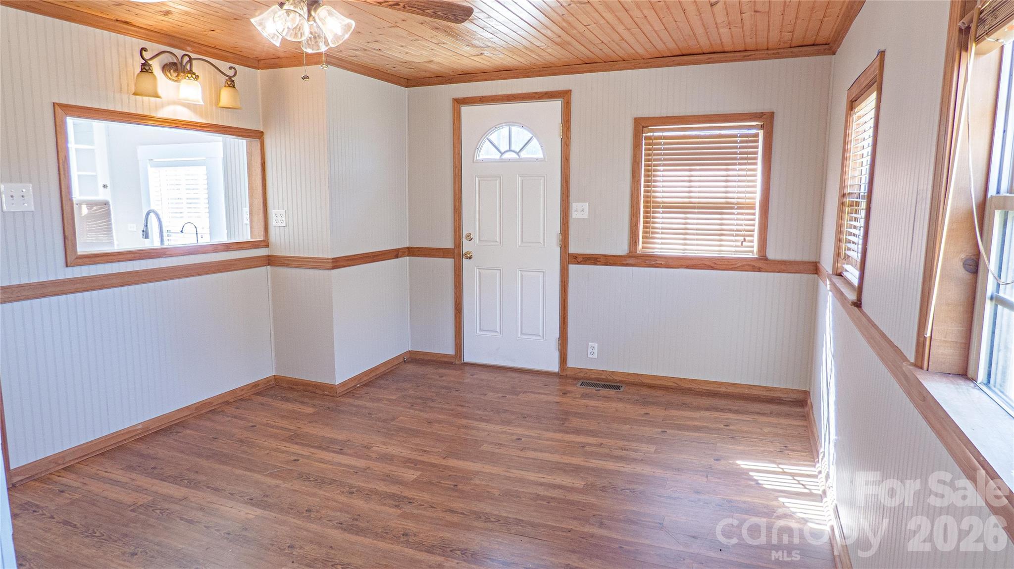 3920 St Peters Church Road Salisbury, NC 28146 - Photo 4 of 32 a view of an empty room with wooden floor and a window