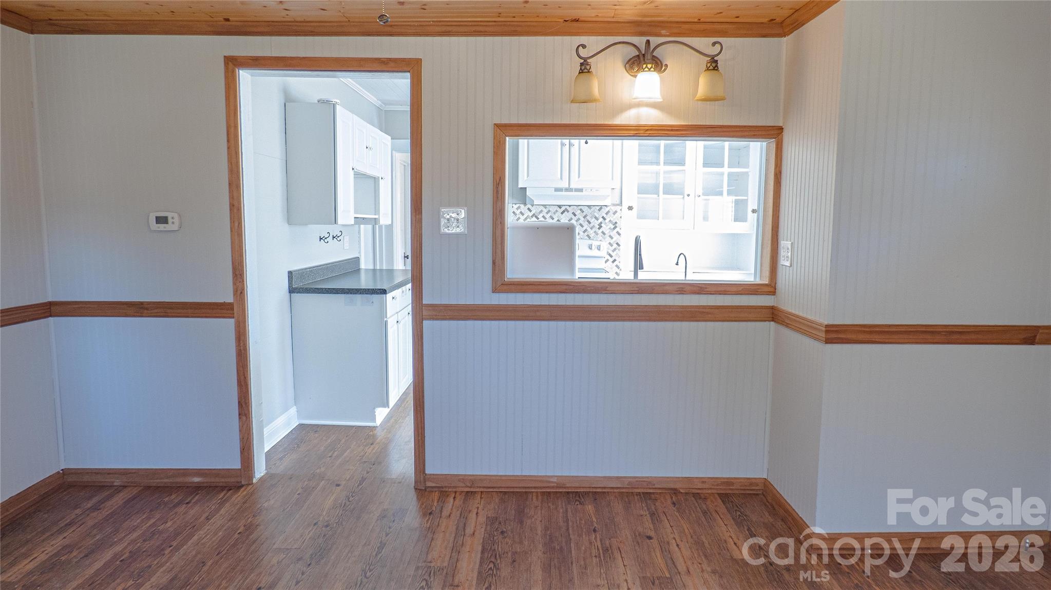 3920 St Peters Church Road Salisbury, NC 28146 - Photo 5 of 32 wooden floor in an empty room with a window