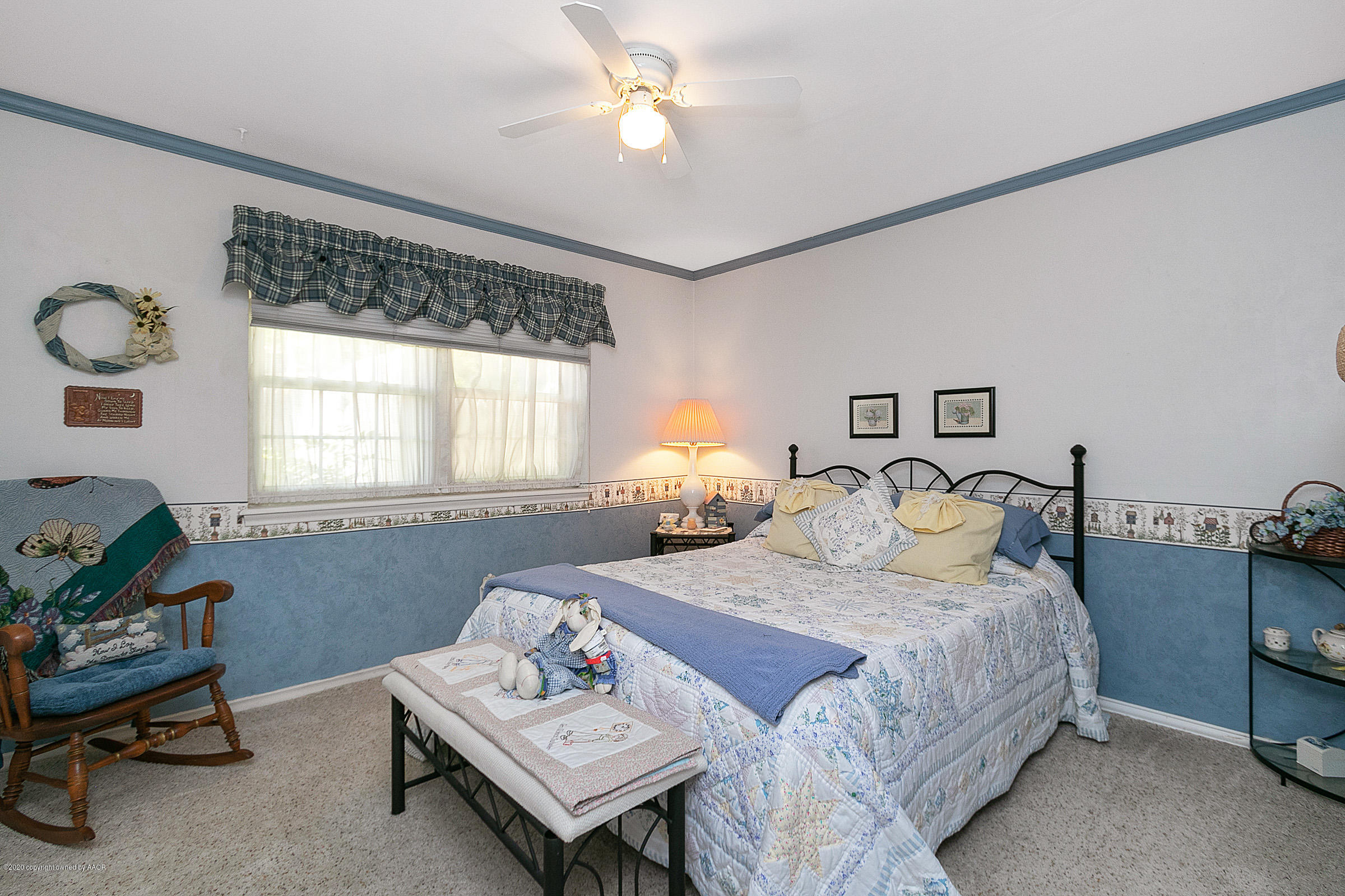 6700 Dreyfuss Road Amarillo, TX 79106 - Photo 25 of 37 a bedroom with a bed and a table