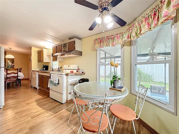 a kitchen with a sink and wooden cabinets