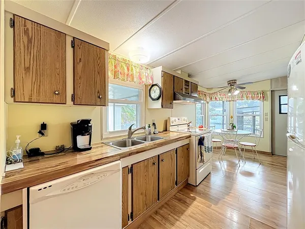 a living room with lots of furniture and a chandelier