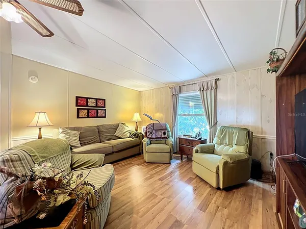 a very nice looking dining room with a table and chairs