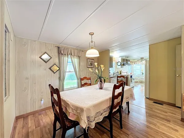 a bedroom with a large bed and a dresser