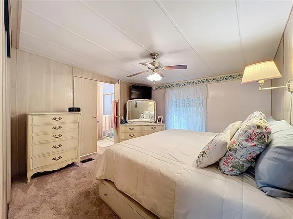 a bathroom with a sink toilet vanity and tub
