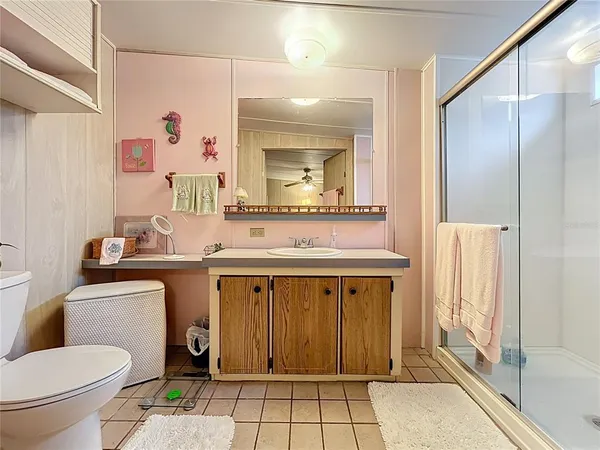 a bedroom with a bed and a tv