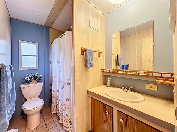 a bedroom with a bed and a closet