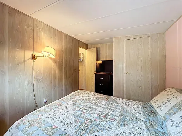 a balcony with furniture and umbrella