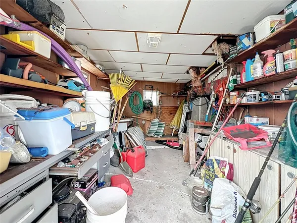 a view of a patio with table and chairs and potted plants