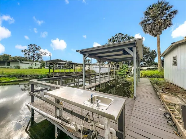 a house view with a seating space and deck