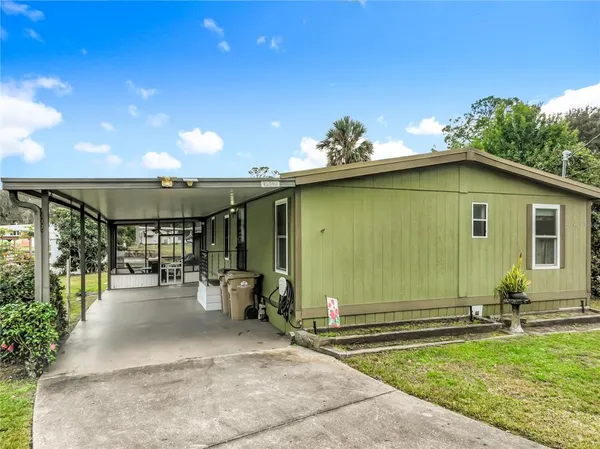 a view of a patio with table and chairs and potted plants