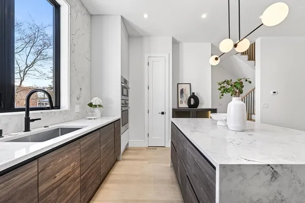 a kitchen with a sink and a refrigerator