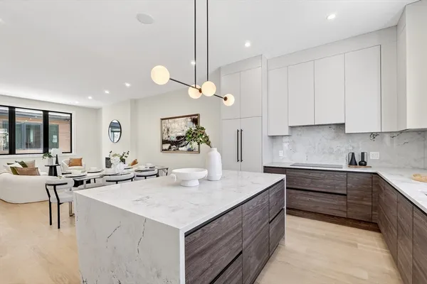 a kitchen with a sink stove and cabinets