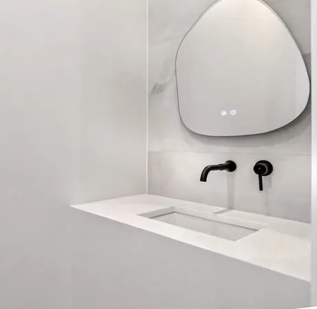 a bathroom with a sink and mirror
