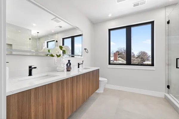 a kitchen with kitchen island a sink appliances and a window