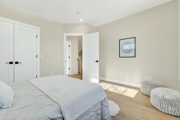 a bedroom with a bed and a couch