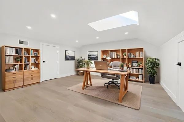 a view of a workspace with furniture