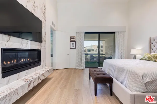 a room with a bed and a night stand