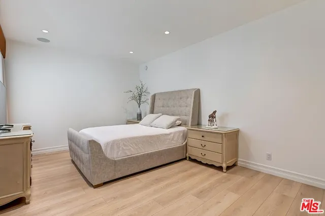 a spacious bathroom with a shower sink mirror and toilet