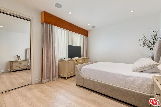 a view of a swimming pool with an outdoor seating