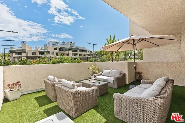 a view of a dining room with furniture and a livingroom