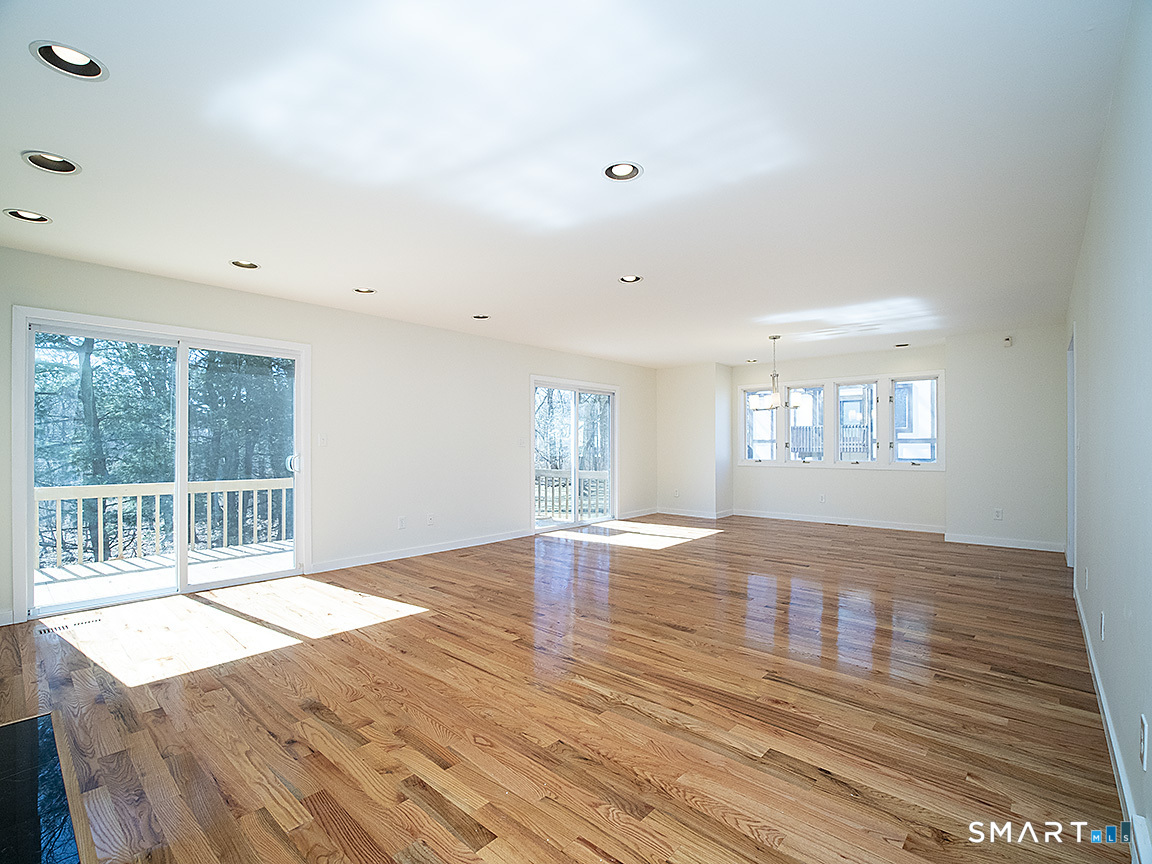 690 Forest Road, Unit 703 West Haven, CT 06516 - Photo 12 of 35 wooden floor in an empty room with a window