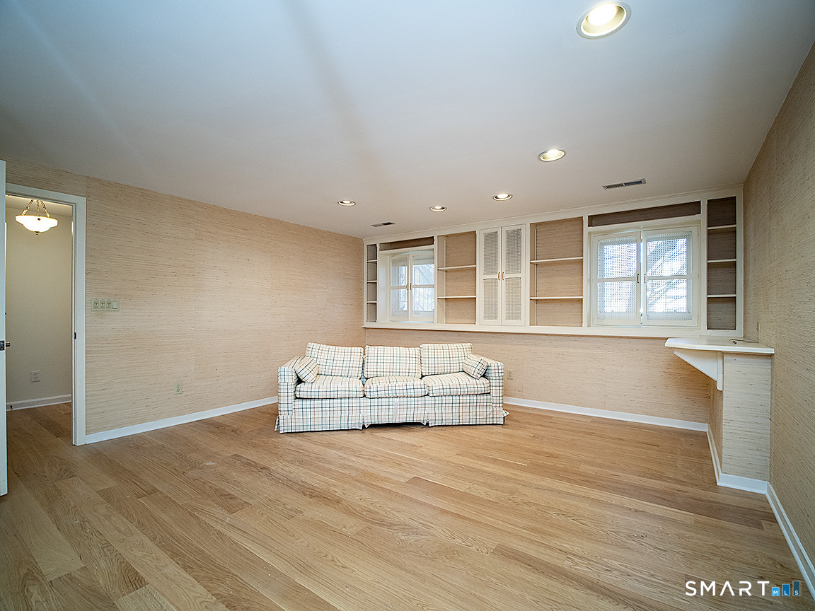 690 Forest Road, Unit 703 West Haven, CT 06516 - Photo 20 of 35 a view of empty room with wooden floor and fan