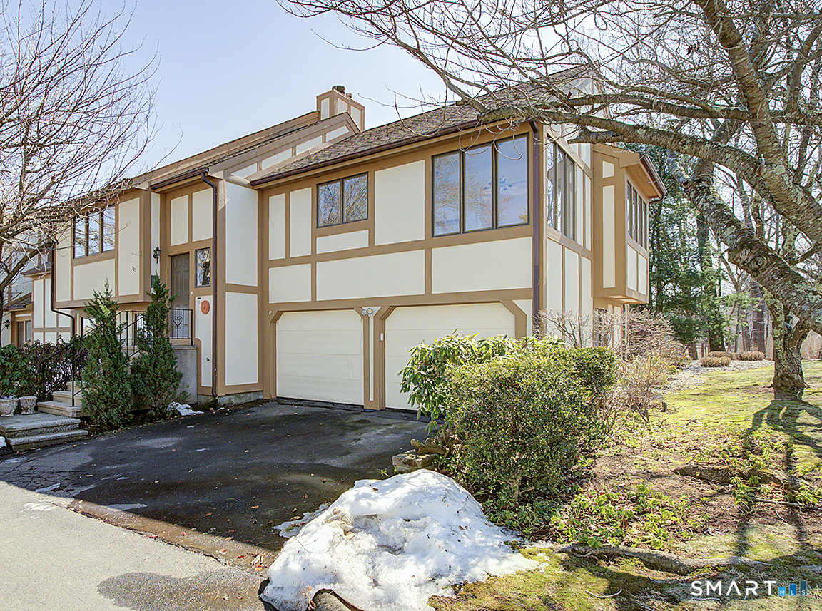 690 Forest Road, Unit 703 West Haven, CT 06516 - Photo 3 of 35 a front view of a house with garden