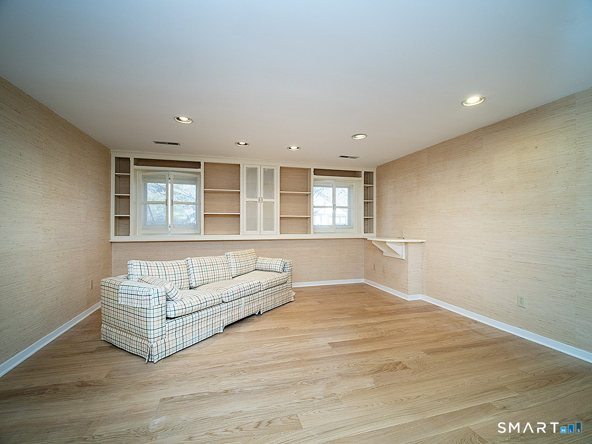 690 Forest Road, Unit 703 West Haven, CT 06516 - Photo 32 of 35 a living room with furniture and a window
