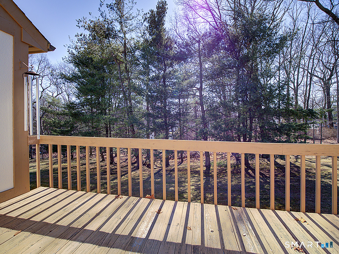 690 Forest Road, Unit 703 West Haven, CT 06516 - Photo 4 of 35 a view of wooden deck