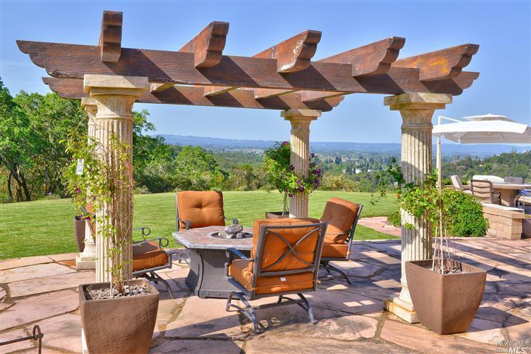 875 Quietwater Ridge Santa Rosa, CA 95404 - Photo 1 of 1 a view of a patio with table and chairs potted plants