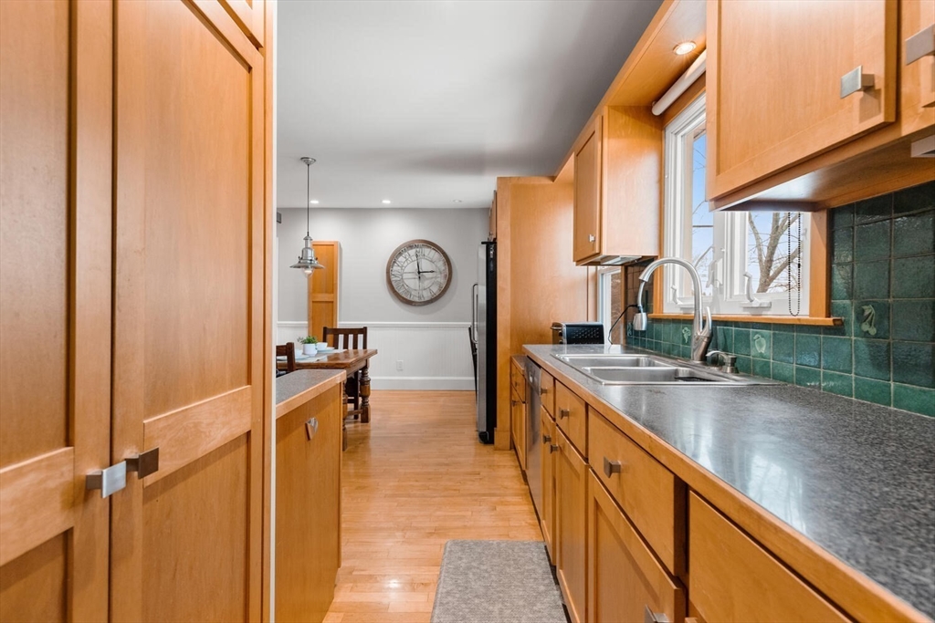 35 Richardson Street, Unit 2 Wakefield, MA 01880 - Photo 11 of 32 a kitchen with granite countertop a sink and a window