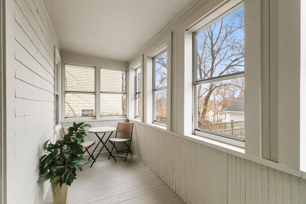 35 Richardson Street, Unit 2 Wakefield, MA 01880 - Photo 26 of 32 a living room filled with furniture and a potted plant