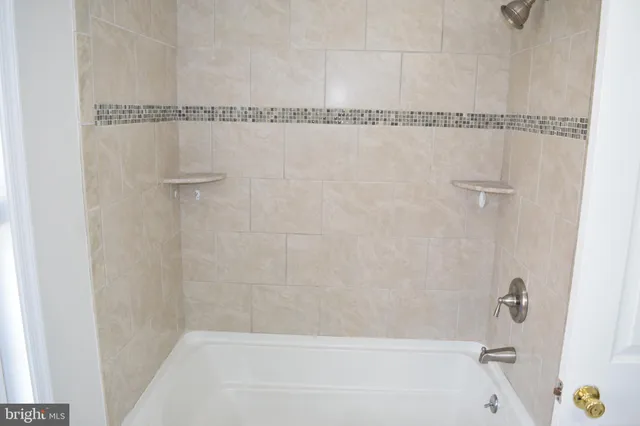 a close view of a bathtub in bathroom