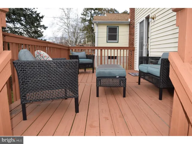 a view of a patio with a bench