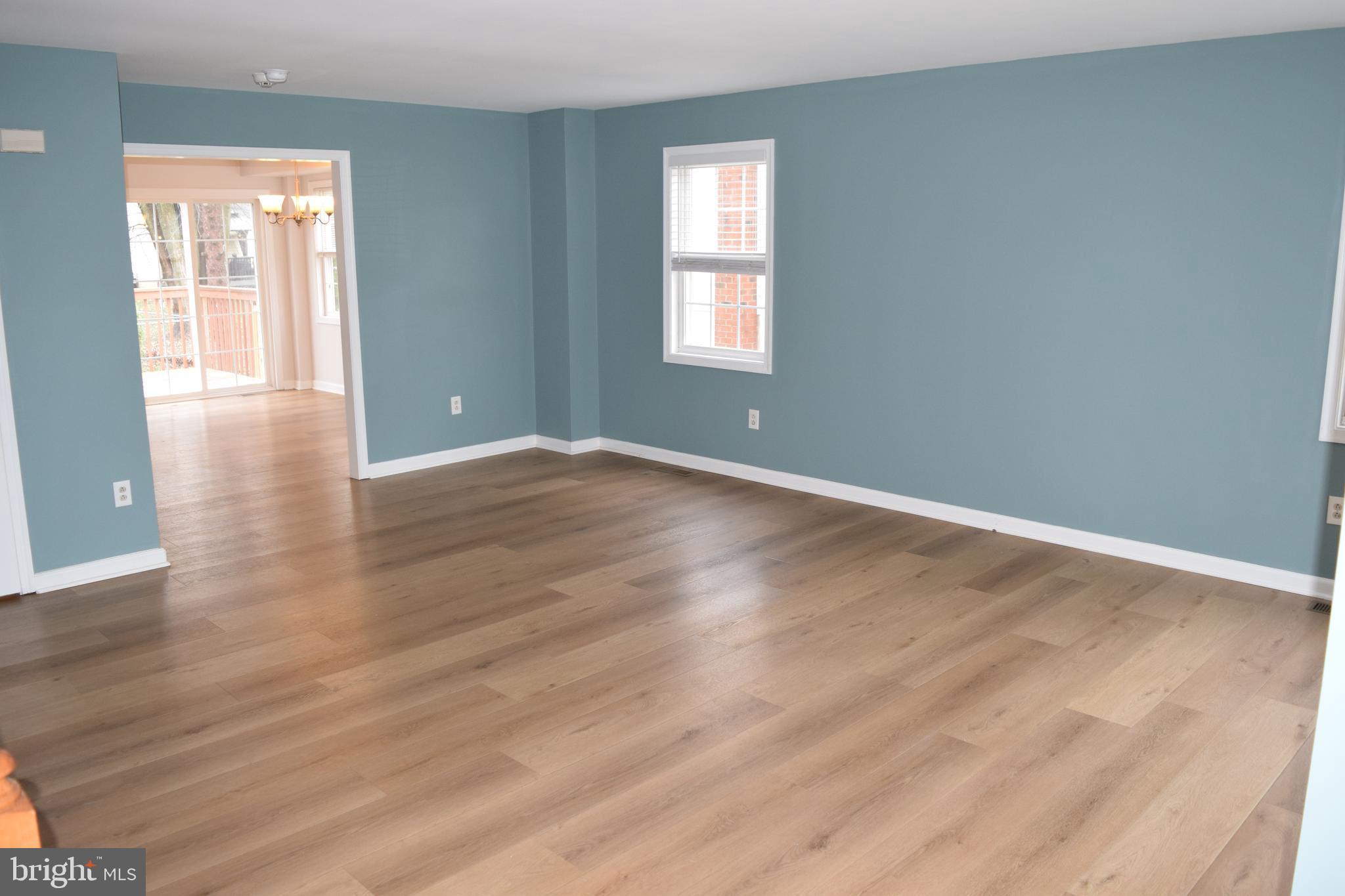 3011 Roberts Road Aston, PA 19014 - Photo 3 of 17 a view of an empty room with wooden floor and a window