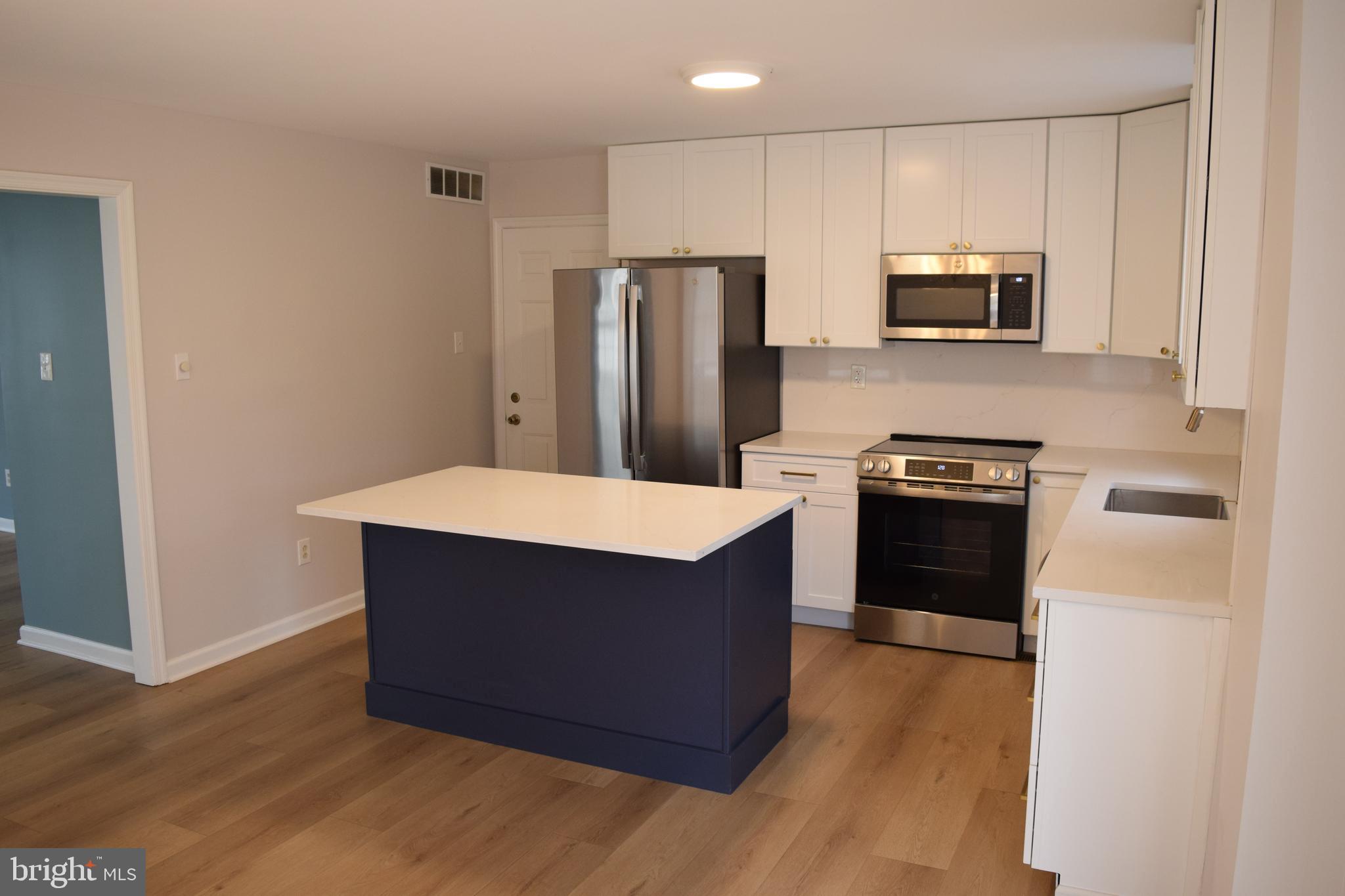 3011 Roberts Road Aston, PA 19014 - Photo 5 of 17 a kitchen with stainless steel appliances a refrigerator stove microwave and sink