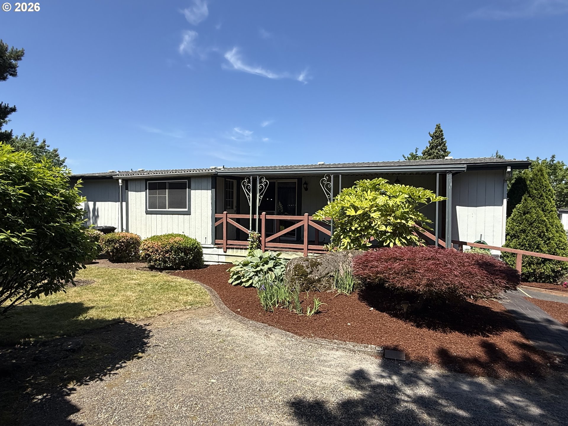21100 Northeast Sandy Boulevard, Unit 18 Fairview, OR 97024 - Photo 35 of 37 a front view of a house with a yard